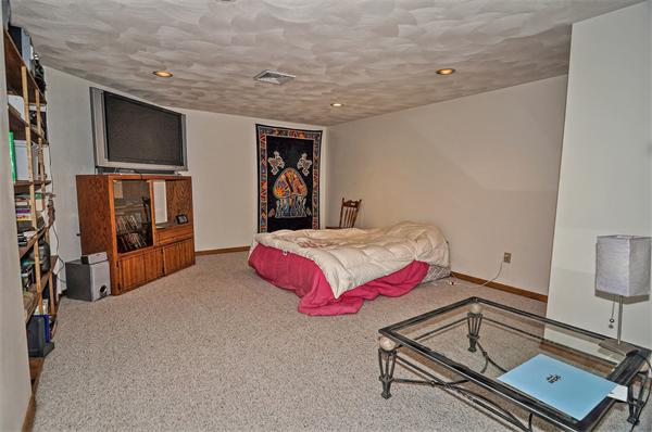 21 Lt J Cabral Drive Middleton, MA 01949 - Photo 26 of 30 a spacious bedroom with a bed and a flat screen tv
