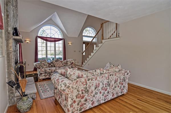 21 Lt J Cabral Drive Middleton, MA 01949 - Photo 7 of 30 a living room with furniture and a large mirror next to a window
