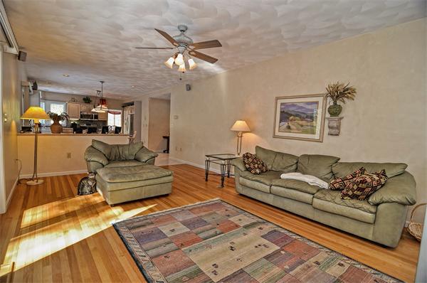 21 Lt J Cabral Drive Middleton, MA 01949 - Photo 10 of 30 a living room with furniture and a chandelier