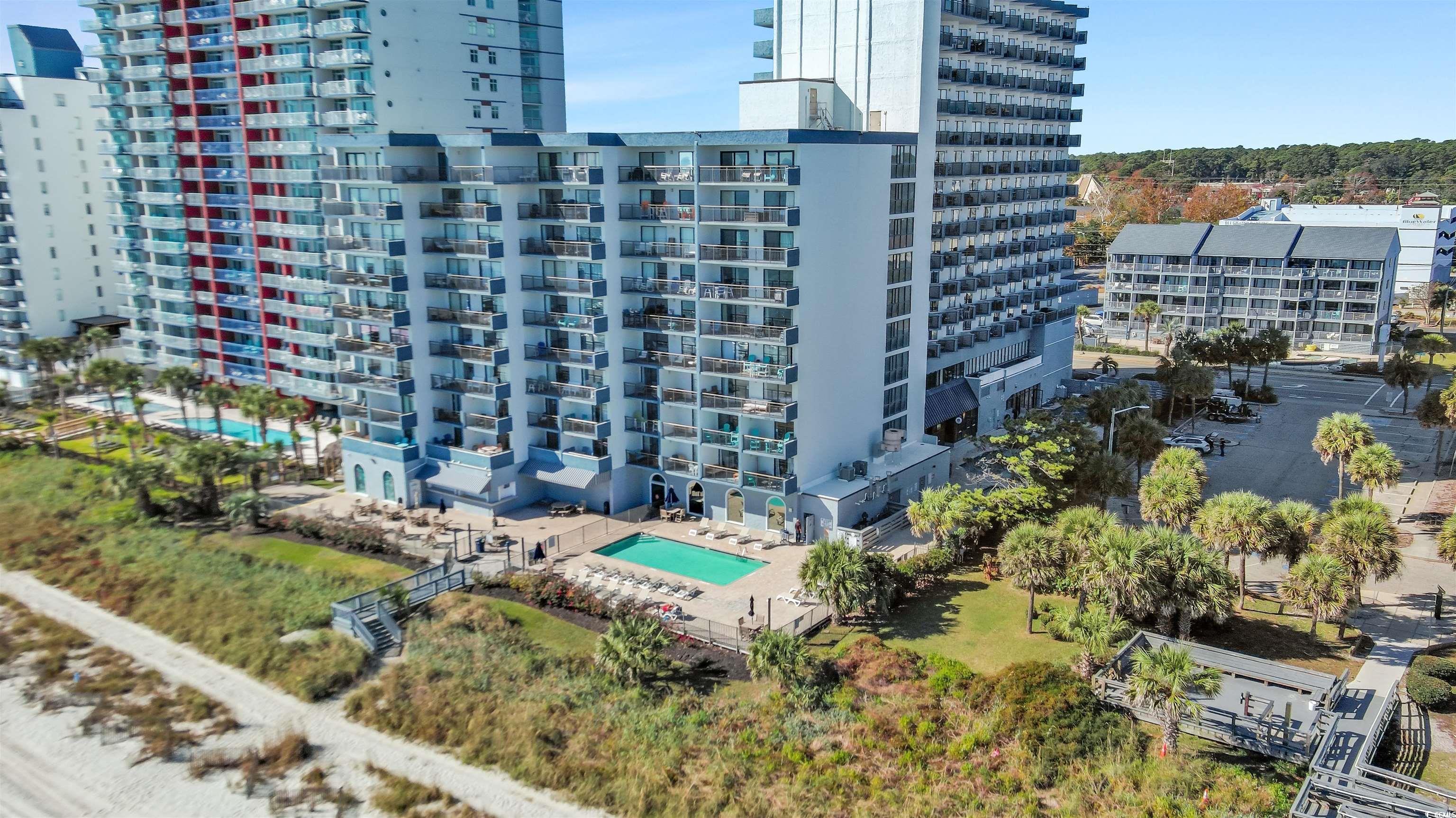 View of urban area with a pool and apartment complex