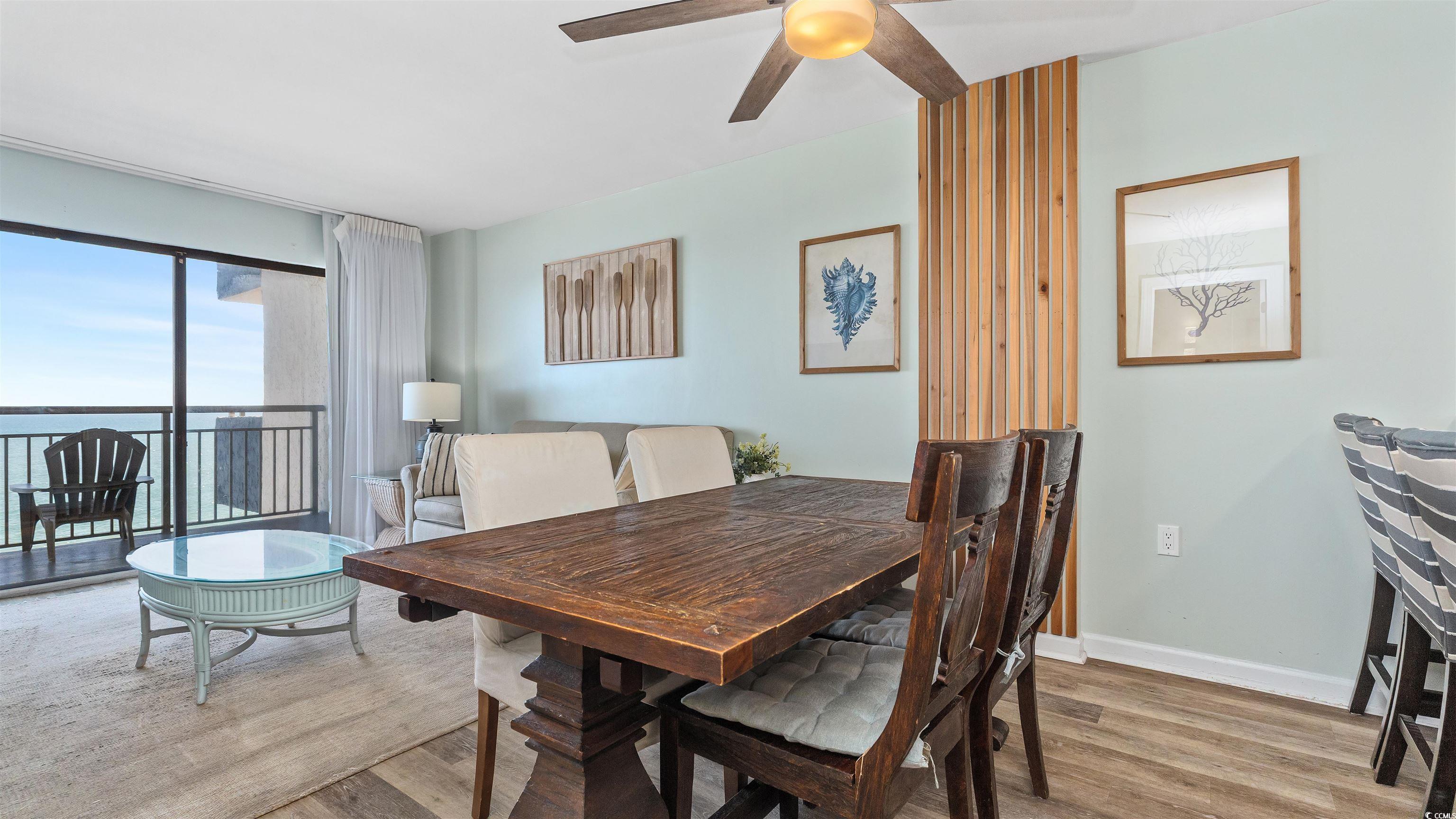 2001 South Ocean Boulevard, Unit 603 Myrtle Beach, SC 29577 - Photo 14 of 33 Dining area featuring light wood-style flooring and a ceiling fan