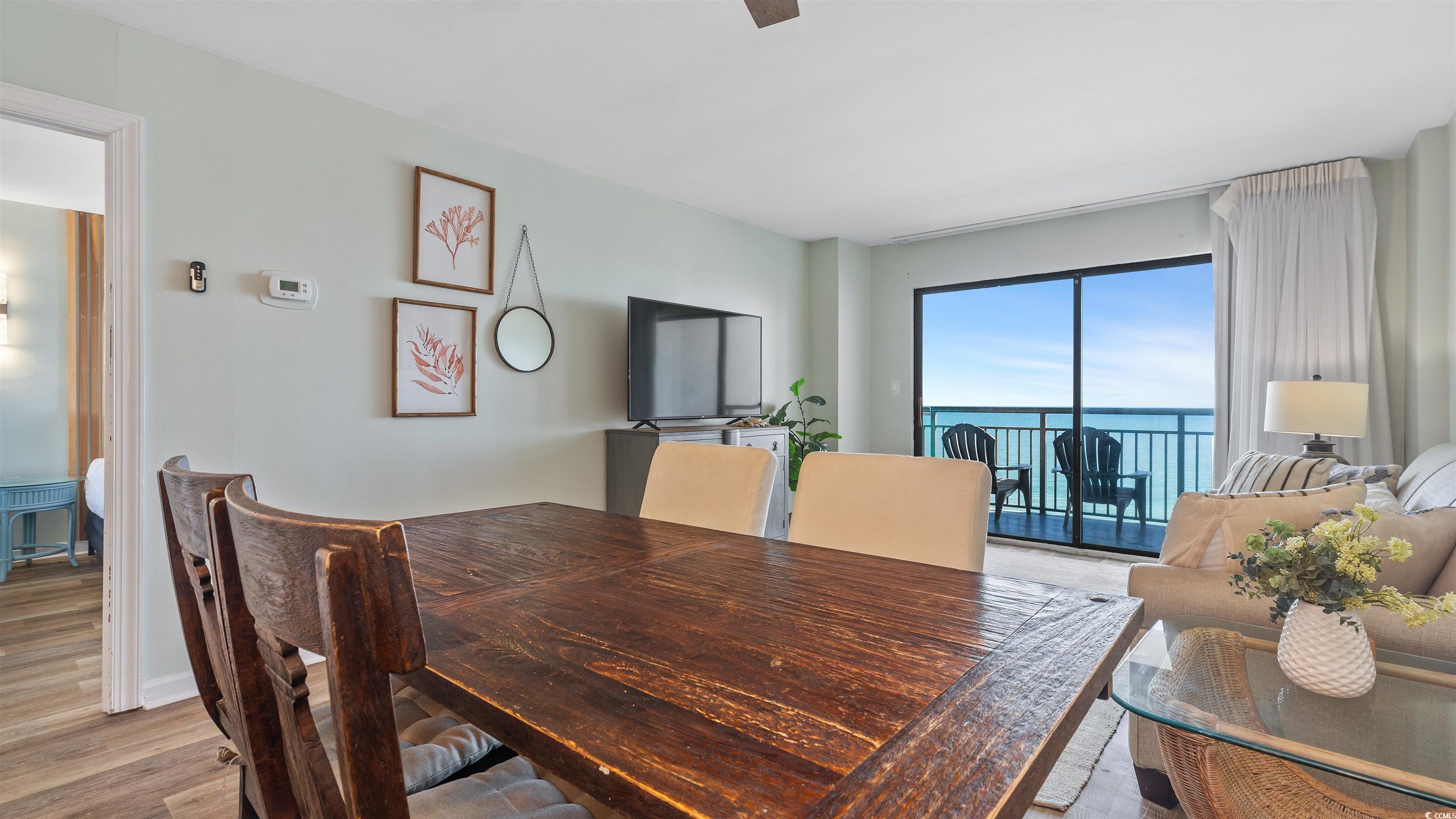 2001 South Ocean Boulevard, Unit 603 Myrtle Beach, SC 29577 - Photo 17 of 33 Dining room featuring wood finished floors and baseboards