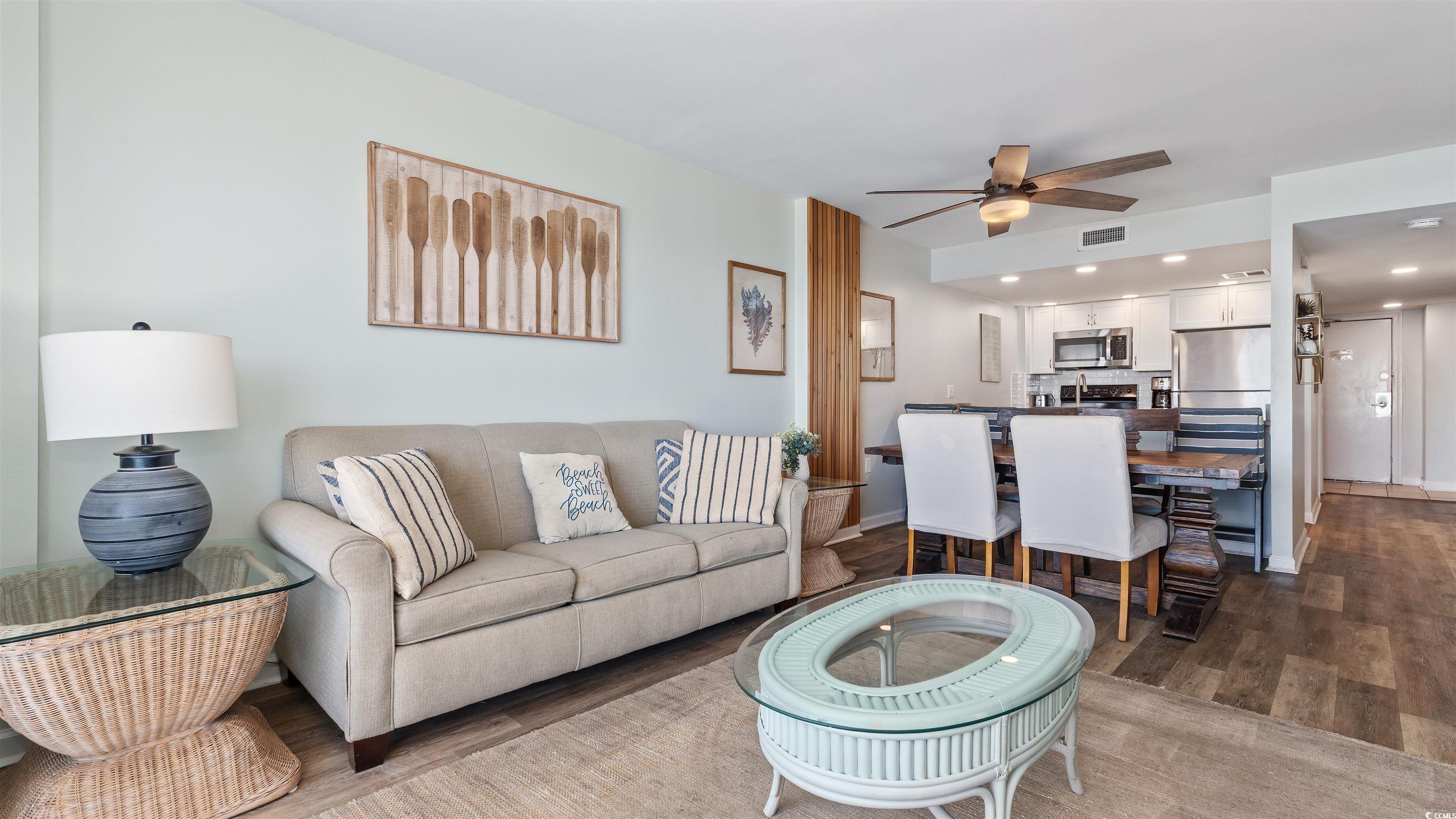 2001 South Ocean Boulevard, Unit 603 Myrtle Beach, SC 29577 - Photo 18 of 33 Living area featuring dark wood finished floors, recessed lighting, and ceiling fan
