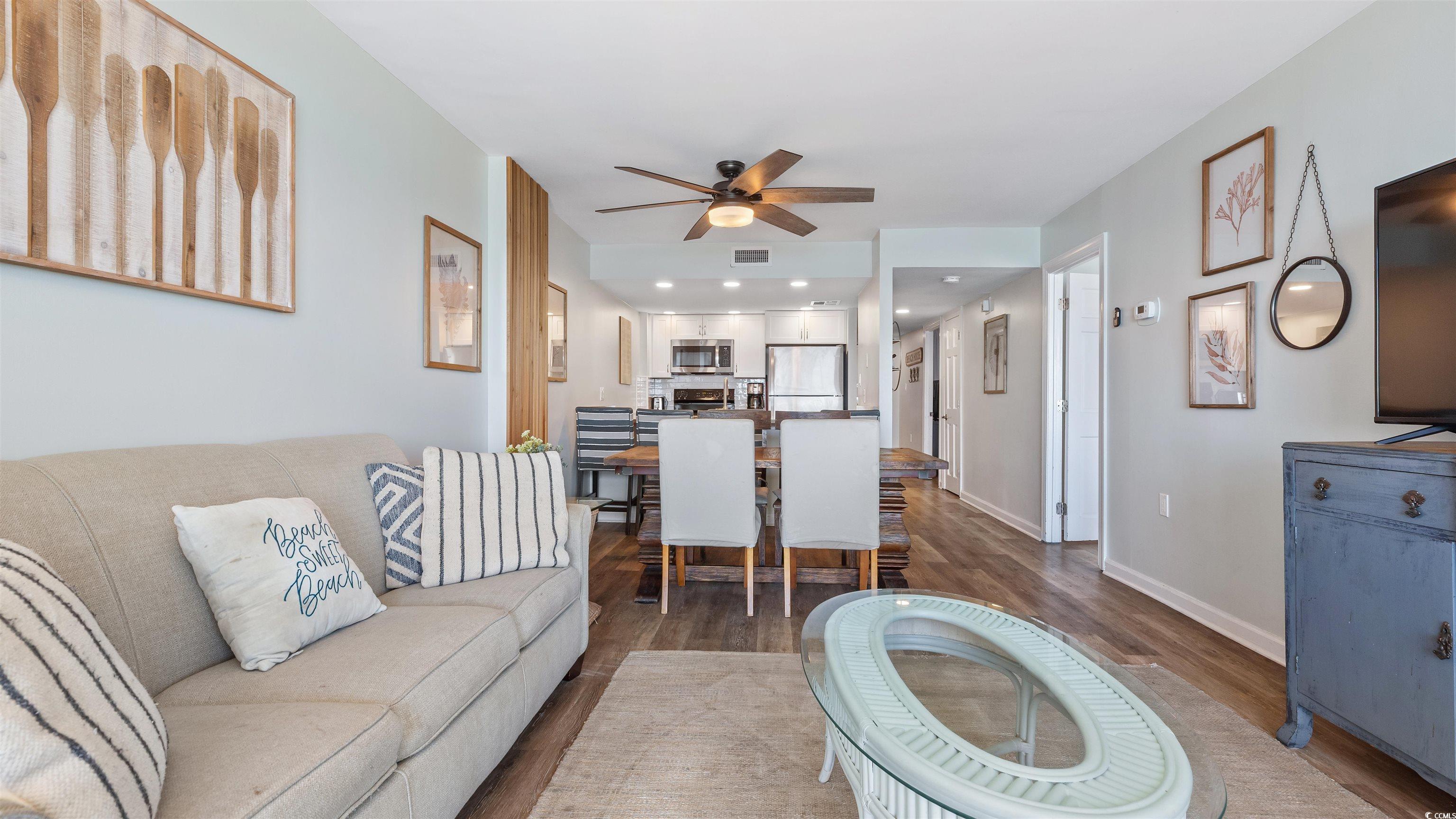 2001 South Ocean Boulevard, Unit 603 Myrtle Beach, SC 29577 - Photo 19 of 33 Living room featuring dark wood-type flooring, ceiling fan, and recessed lighting