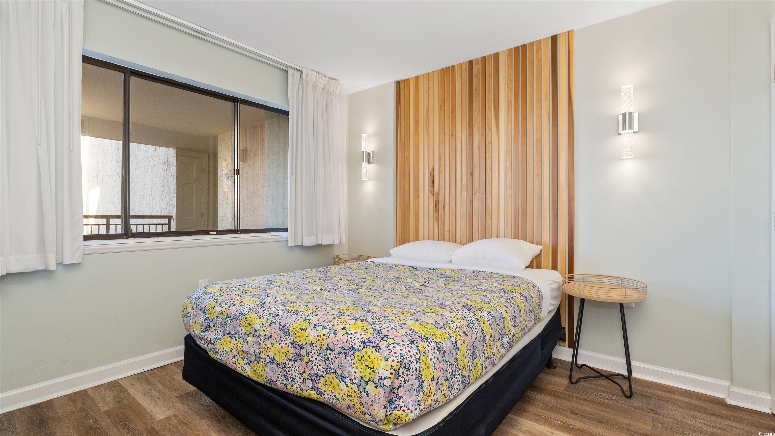 2001 South Ocean Boulevard, Unit 603 Myrtle Beach, SC 29577 - Photo 24 of 33 Bedroom featuring wood finished floors