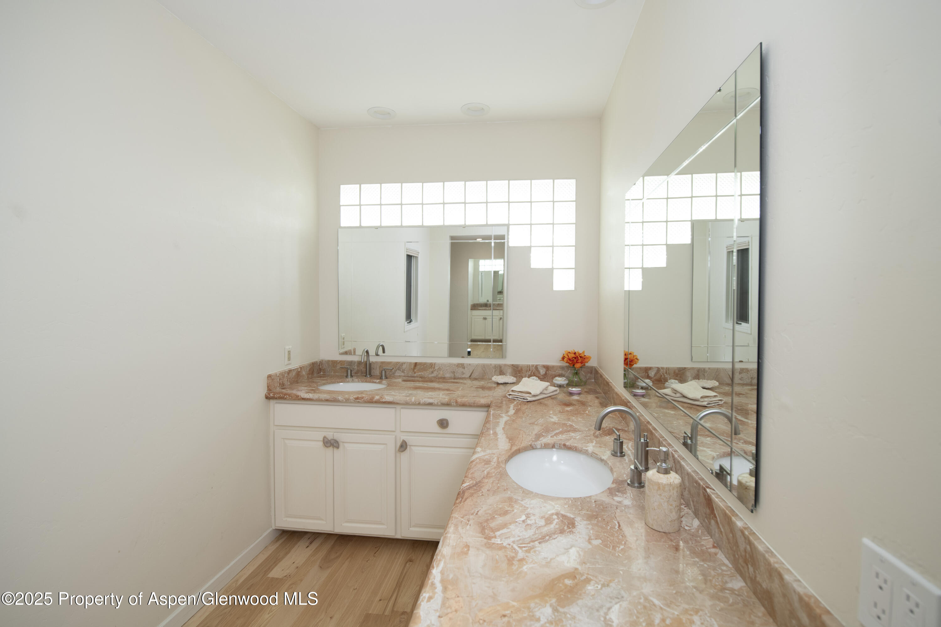 1417 Sierra Vista Drive Aspen, CO 81611 - Photo 16 of 37 a bathroom with a granite countertop sink and a mirror