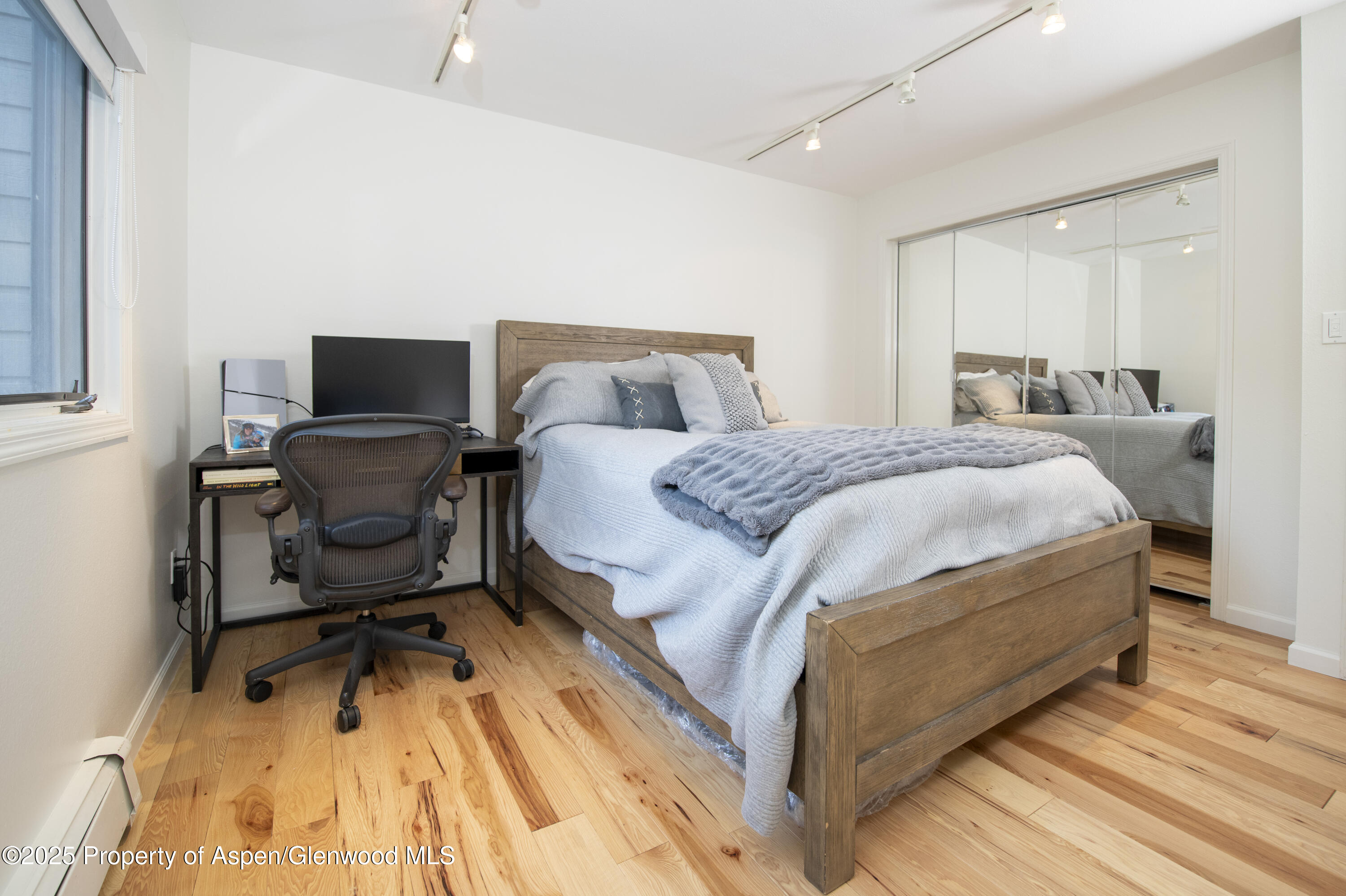 1417 Sierra Vista Drive Aspen, CO 81611 - Photo 20 of 37 a bedroom with a bed a desk and chair