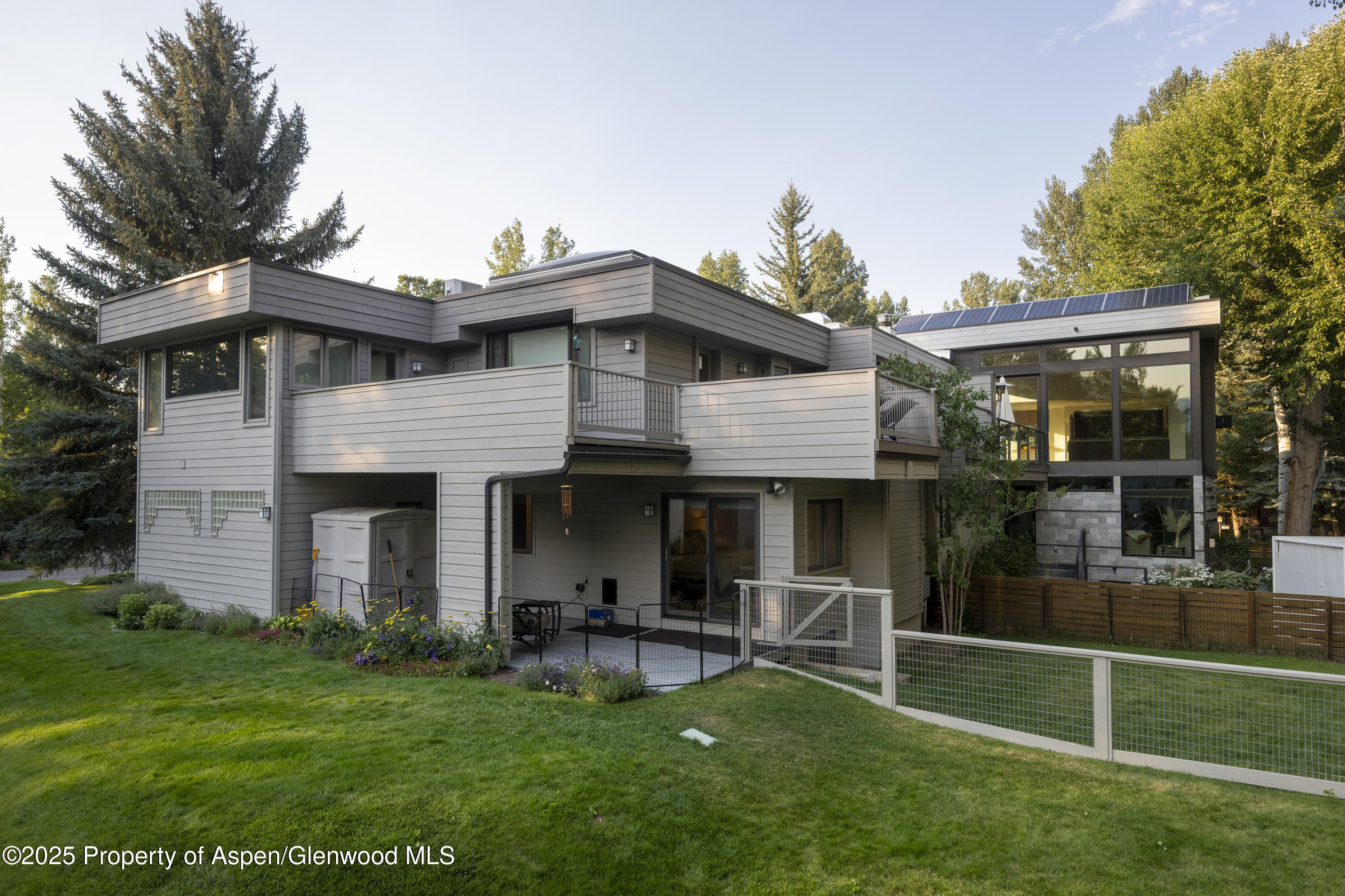 1417 Sierra Vista Drive Aspen, CO 81611 - Photo 2 of 37 a front view of a house with a garden