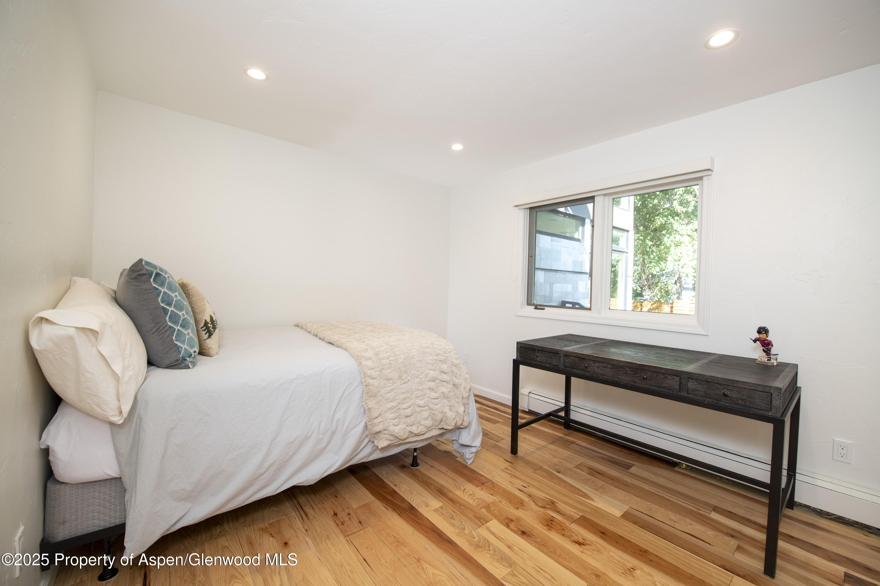1417 Sierra Vista Drive Aspen, CO 81611 - Photo 25 of 37 a bedroom with a bed and a window