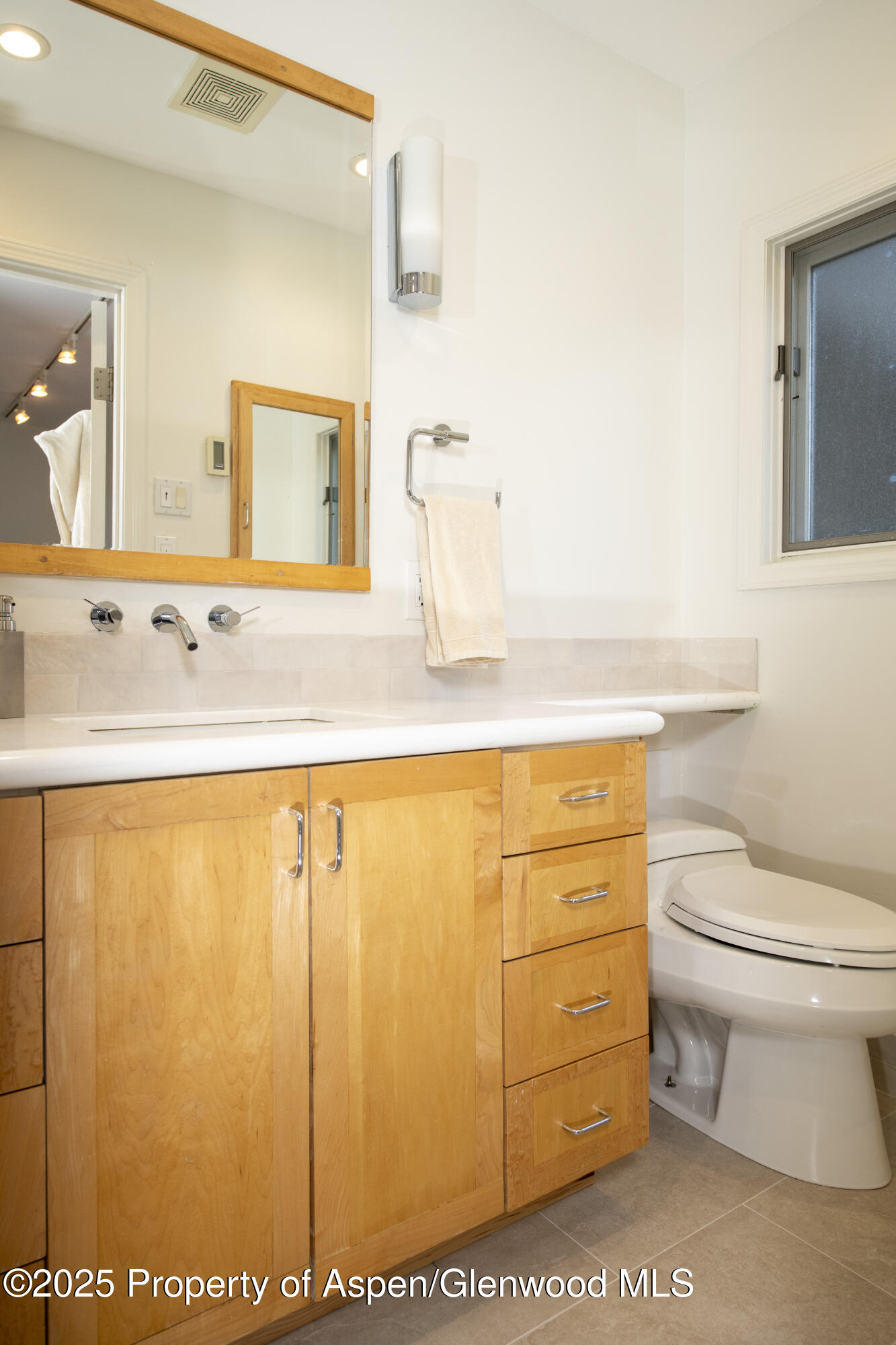 1417 Sierra Vista Drive Aspen, CO 81611 - Photo 27 of 37 a bathroom with a granite countertop sink and a mirror