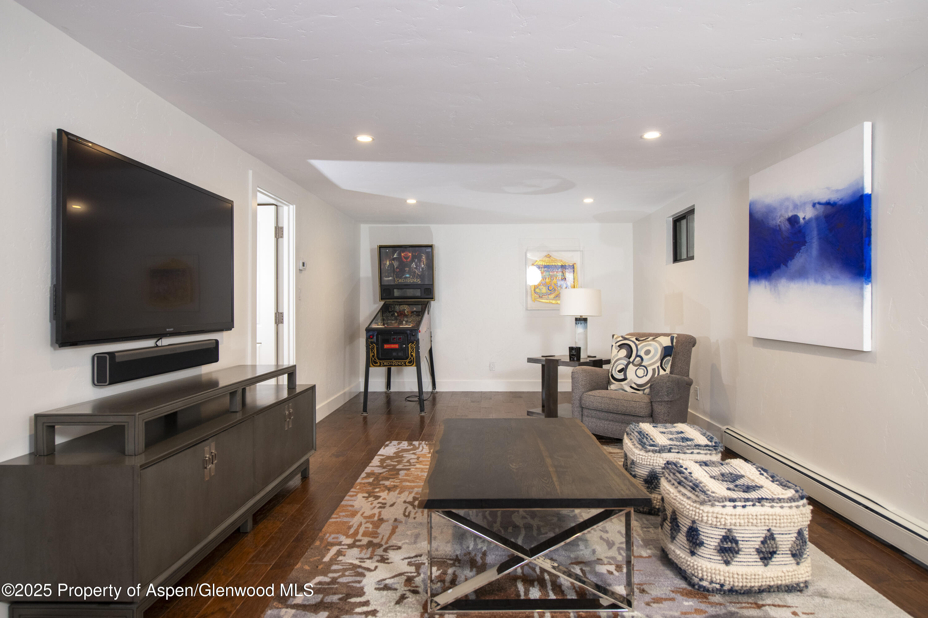 1417 Sierra Vista Drive Aspen, CO 81611 - Photo 31 of 37 a living room with furniture and a flat screen tv