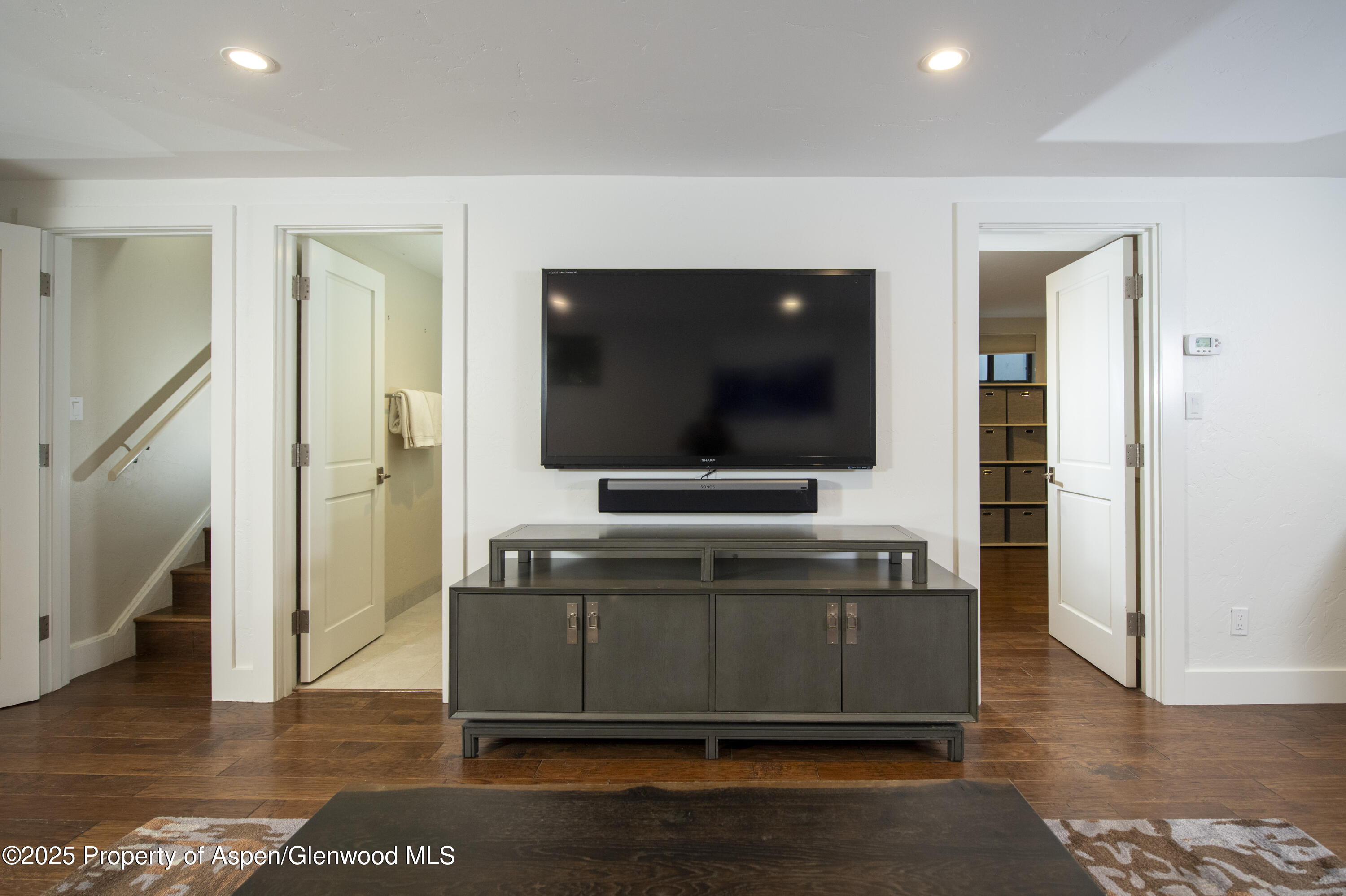 1417 Sierra Vista Drive Aspen, CO 81611 - Photo 32 of 37 a living room with furniture and a flat screen tv