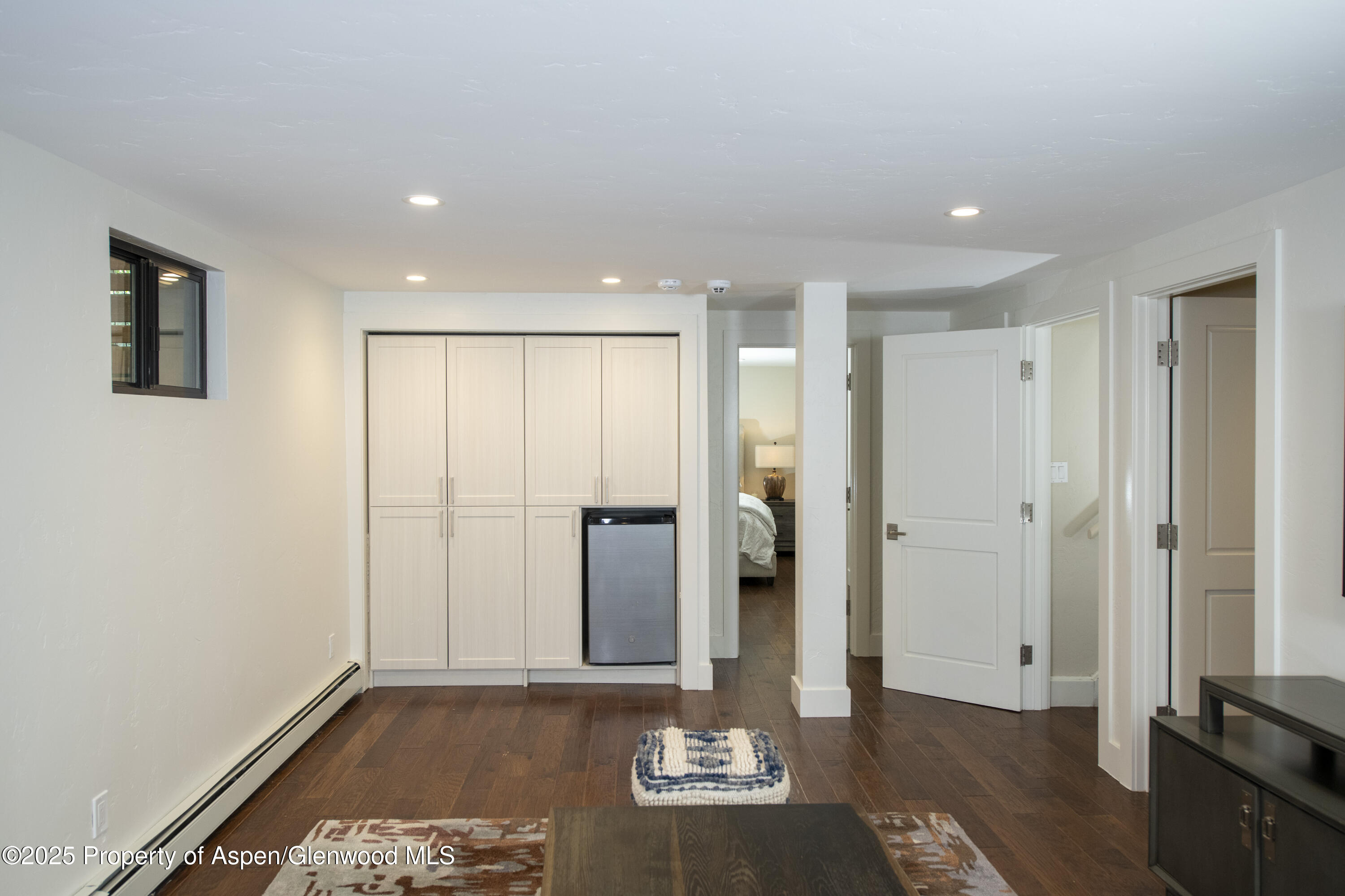 1417 Sierra Vista Drive Aspen, CO 81611 - Photo 33 of 37 a view of a hallway with wooden floor and cabinet