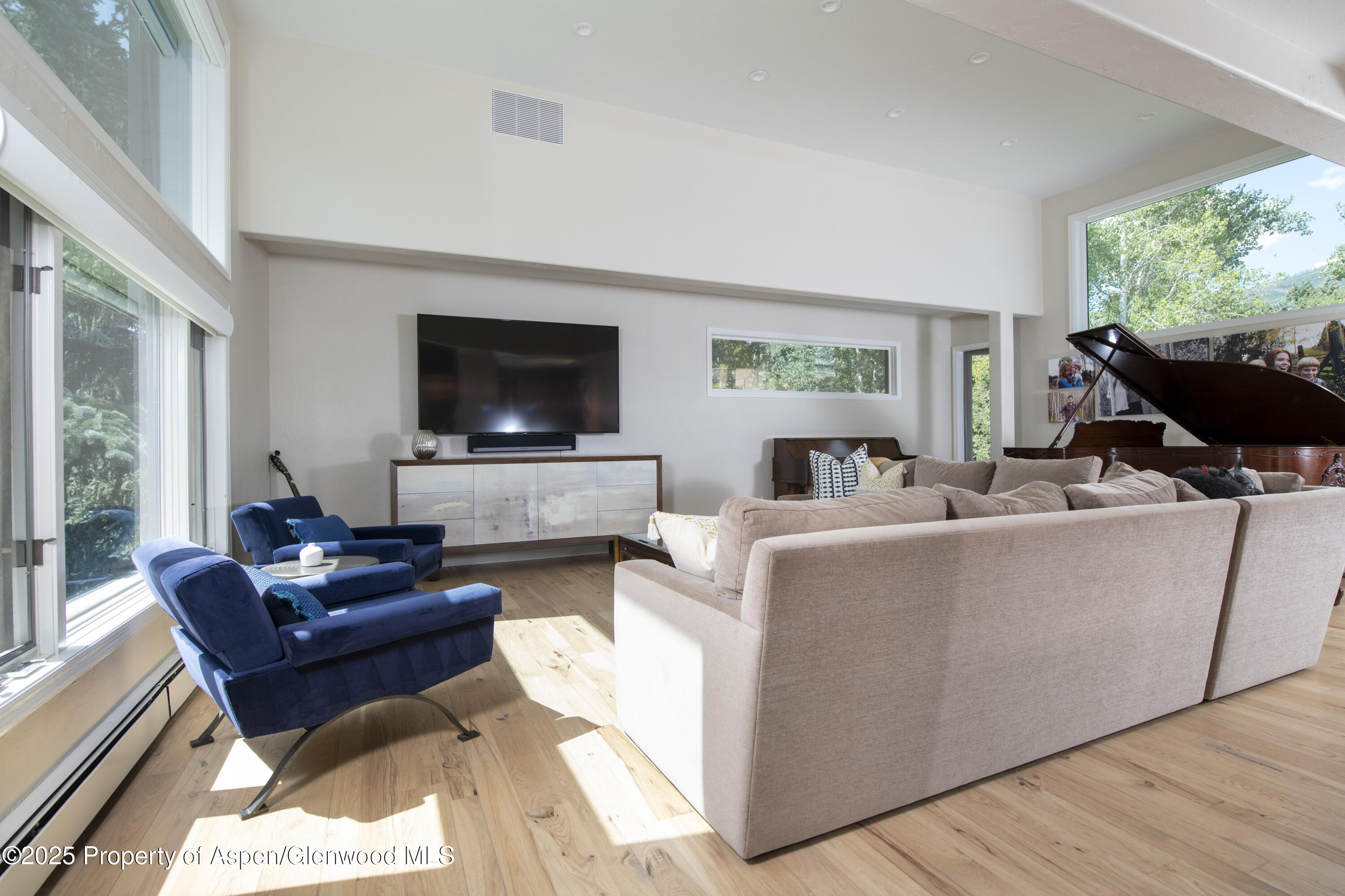 1417 Sierra Vista Drive Aspen, CO 81611 - Photo 4 of 37 a living room with furniture and a flat screen tv