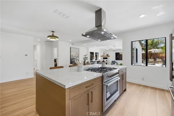 a kitchen with a stove and a sink