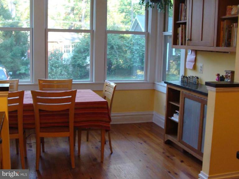 5717 Uffington Road Baltimore, MD 21209 - Photo 11 of 19 a view of a dining room with furniture window and wooden floor