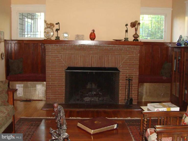 5717 Uffington Road Baltimore, MD 21209 - Photo 14 of 19 a fireplace with table and chairs