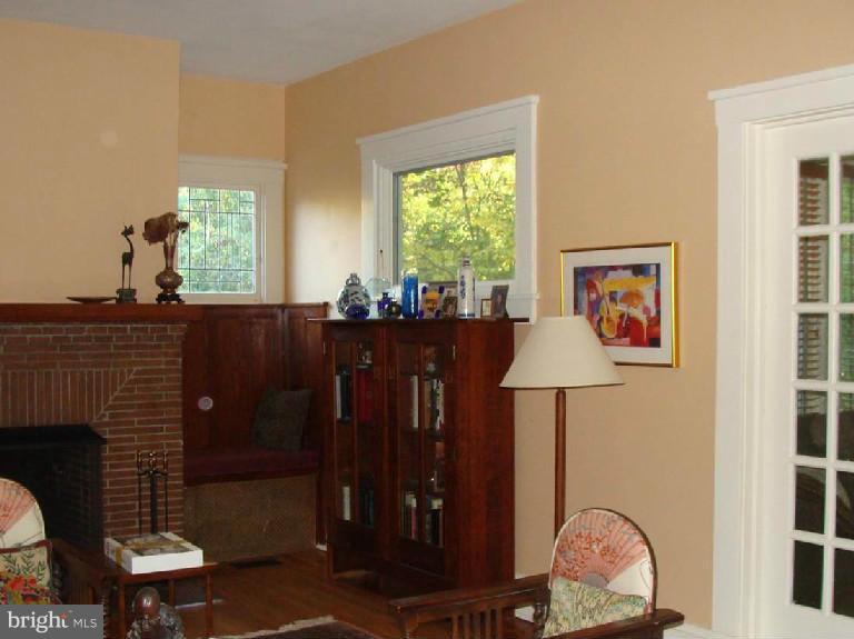 5717 Uffington Road Baltimore, MD 21209 - Photo 15 of 19 a living room with furniture a window and potted plants