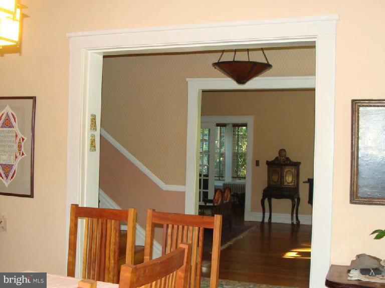 5717 Uffington Road Baltimore, MD 21209 - Photo 4 of 19 a view of a hallway with wooden floor and dining room view