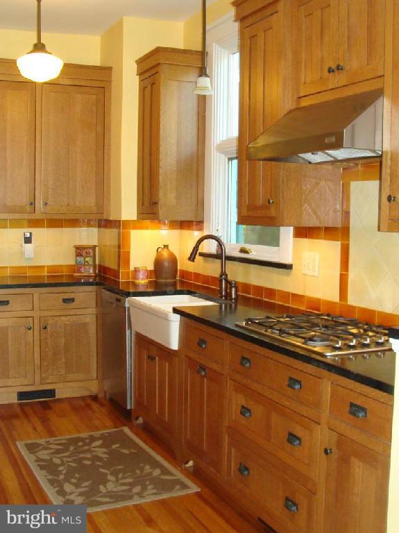 5717 Uffington Road Baltimore, MD 21209 - Photo 8 of 19 a kitchen with granite countertop a sink and a stove