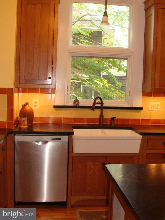 5717 Uffington Road Baltimore, MD 21209 - Photo 9 of 19 a kitchen with a sink a window and cabinets