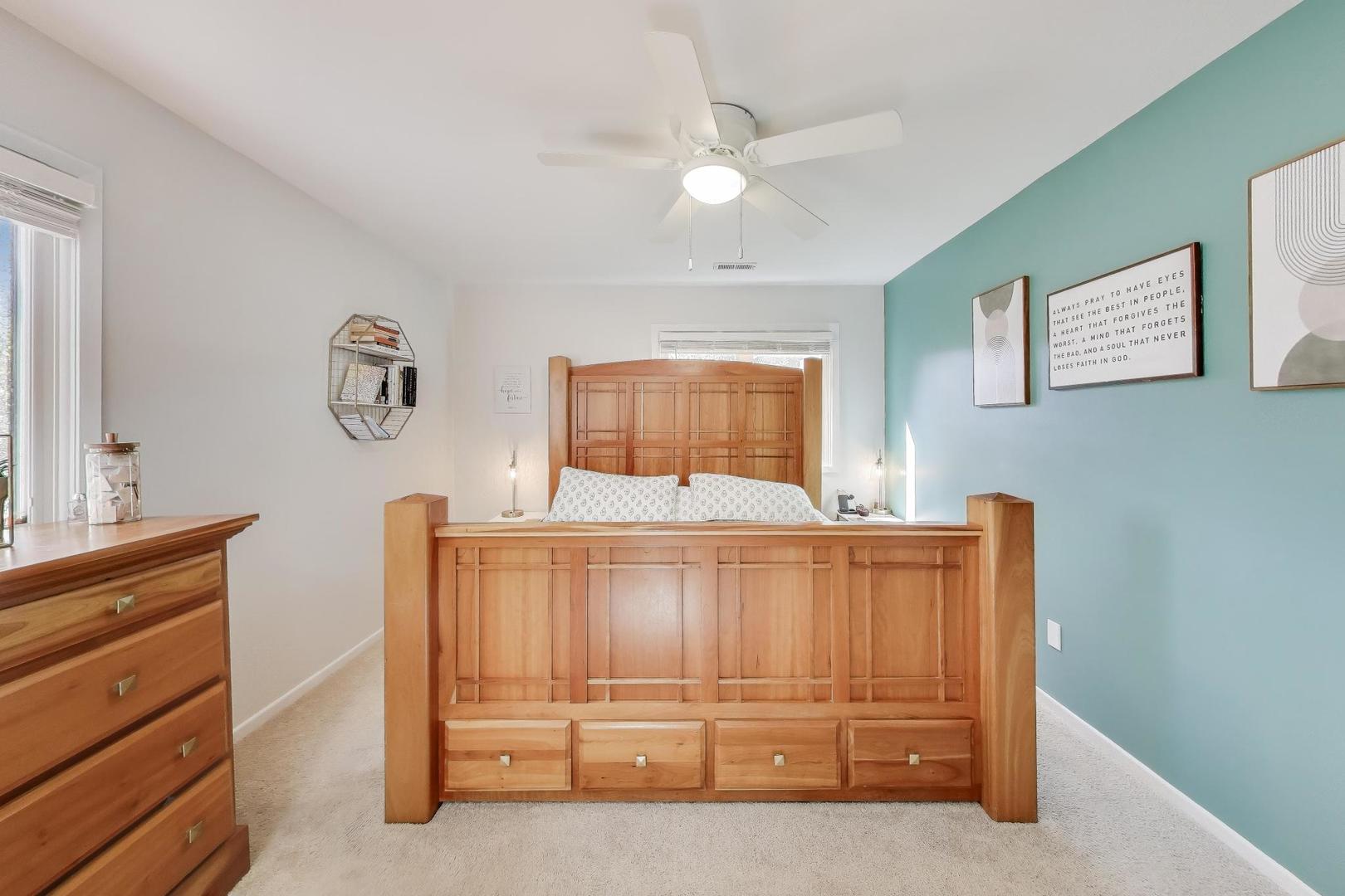 1424 Stonebridge Circle, Unit L4 Wheaton, IL 60189 - Photo 13 of 24 a bedroom with a bed and a dresser