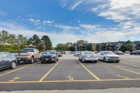 a view of street with parked cars