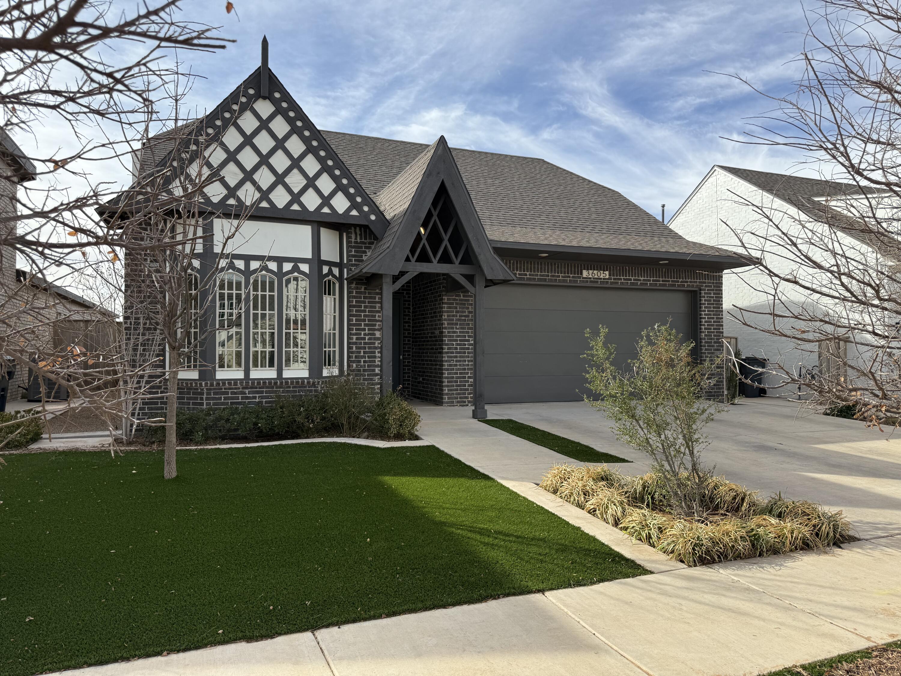 3605 128th Street Lubbock, TX 79423 - Photo 1 of 23 a front view of a house with a yard