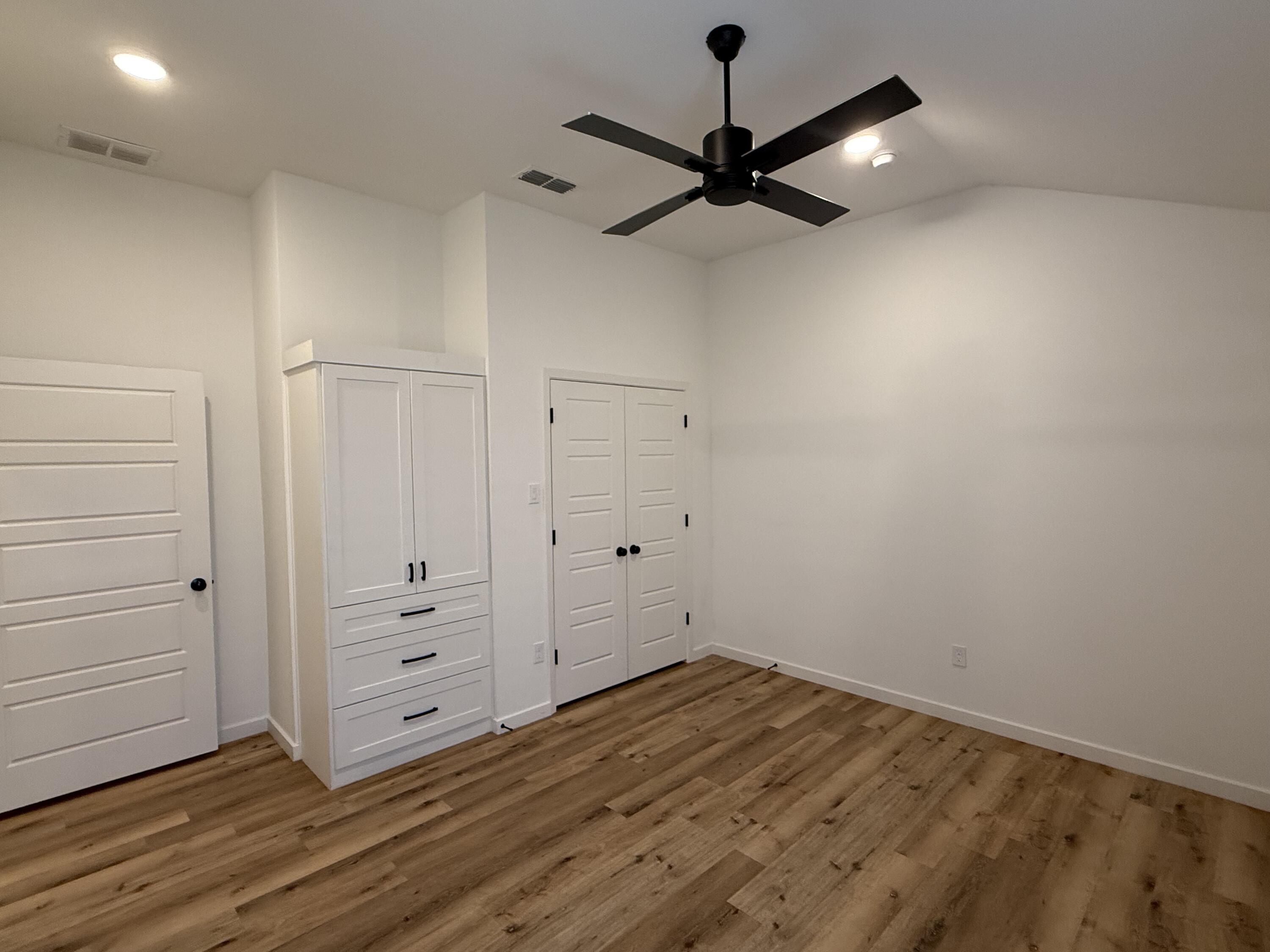 3605 128th Street Lubbock, TX 79423 - Photo 14 of 23 wooden floor in an empty room