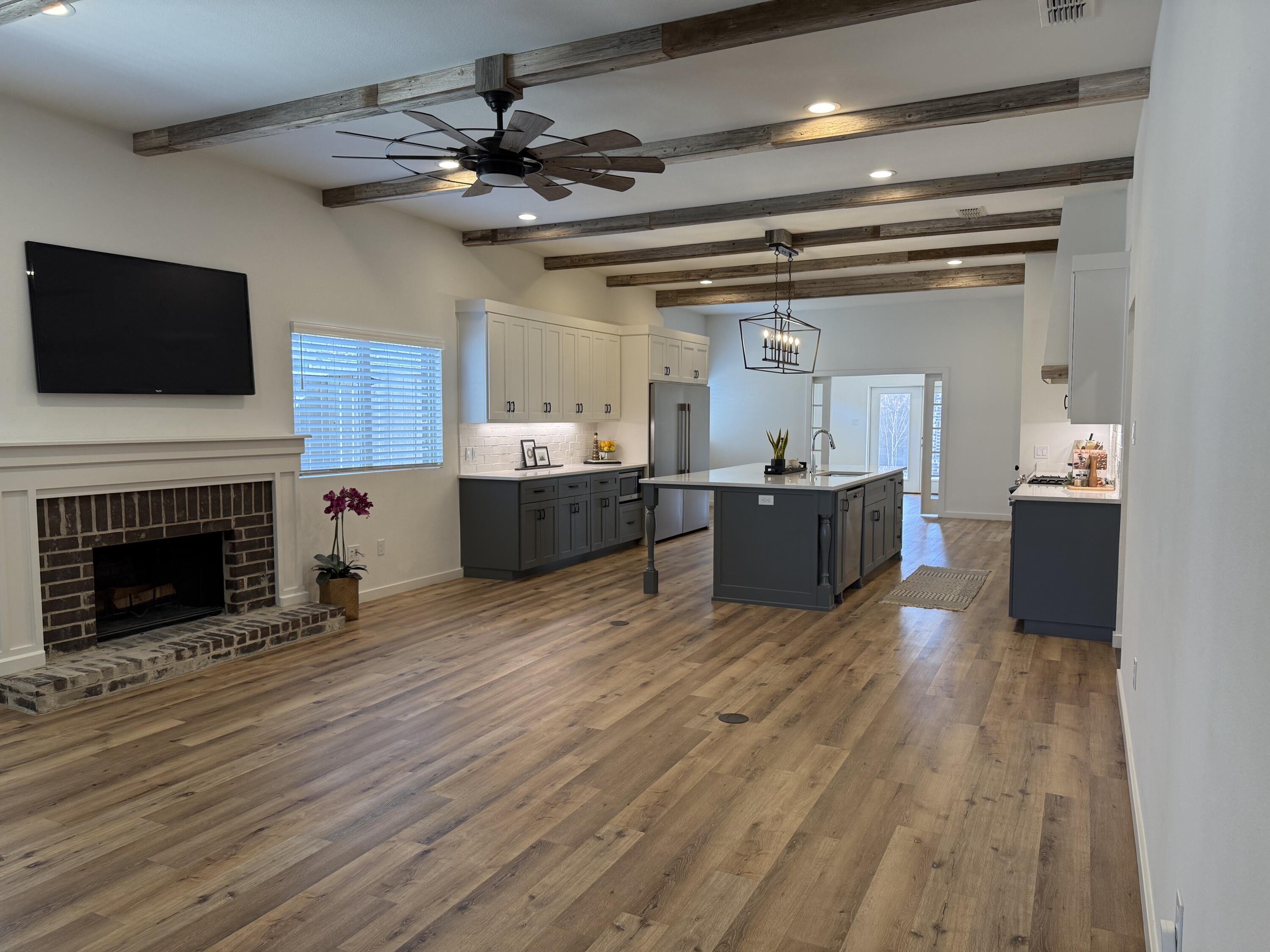3605 128th Street Lubbock, TX 79423 - Photo 2 of 23 a living room with furniture and a fireplace