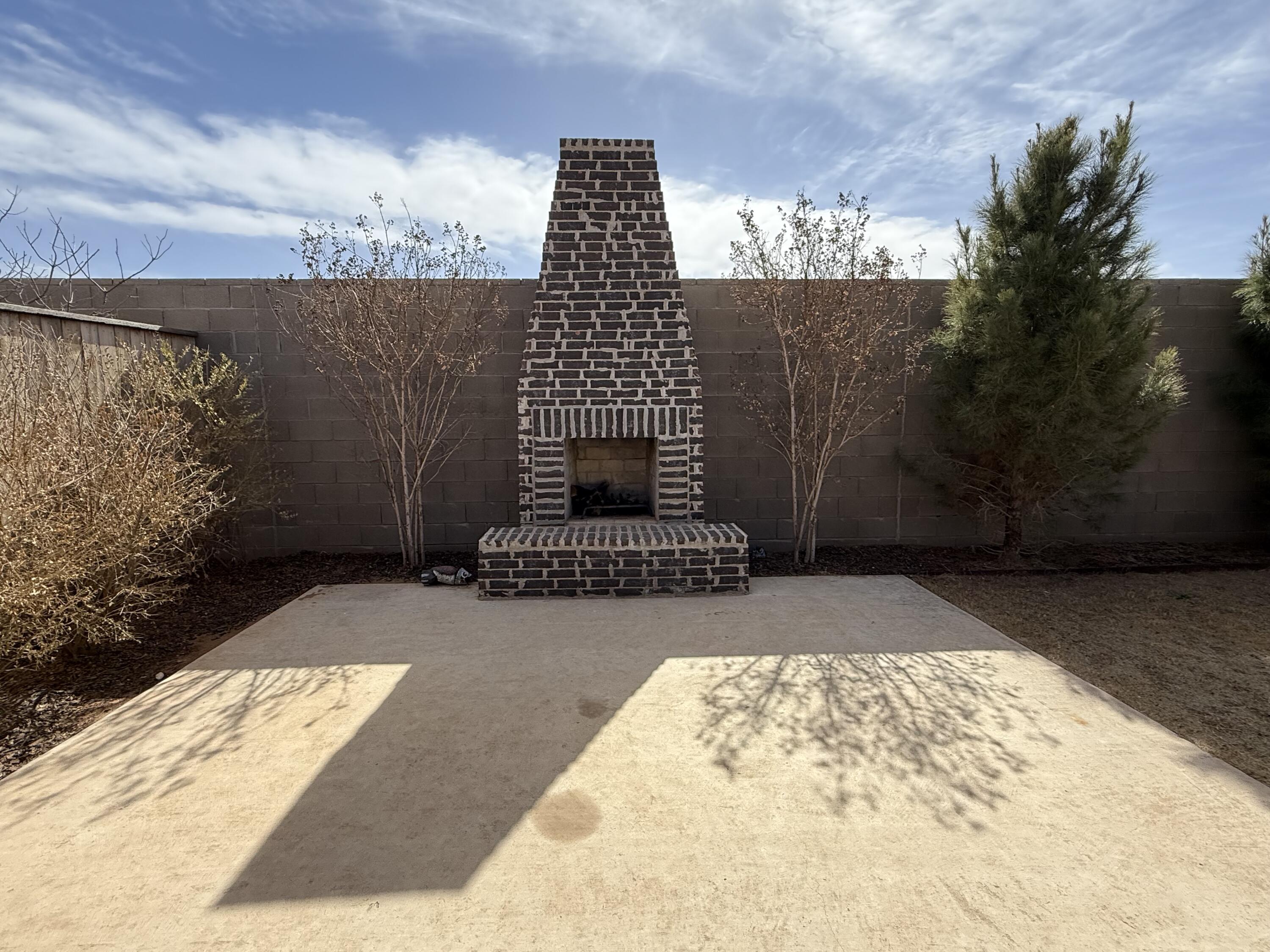 3605 128th Street Lubbock, TX 79423 - Photo 22 of 23 a view of a brick house with a yard