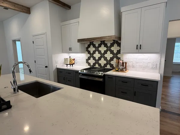 a kitchen with a sink and cabinets