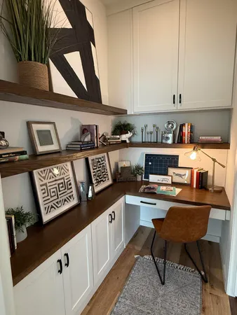 a view of a kitchen with stainless steel appliances granite countertop a sink and cabinets