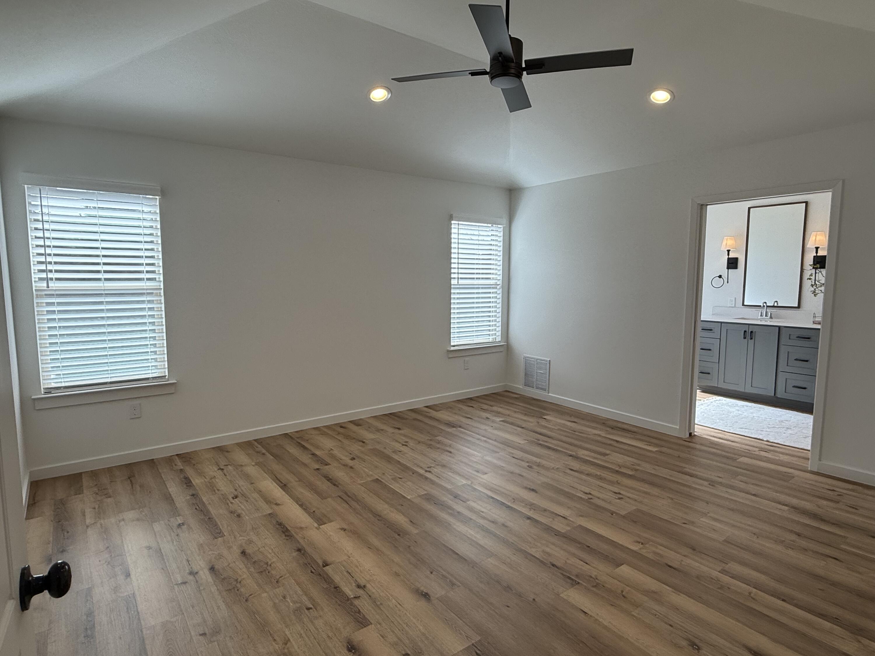 3605 128th Street Lubbock, TX 79423 - Photo 9 of 23 wooden floor in an empty room with a window