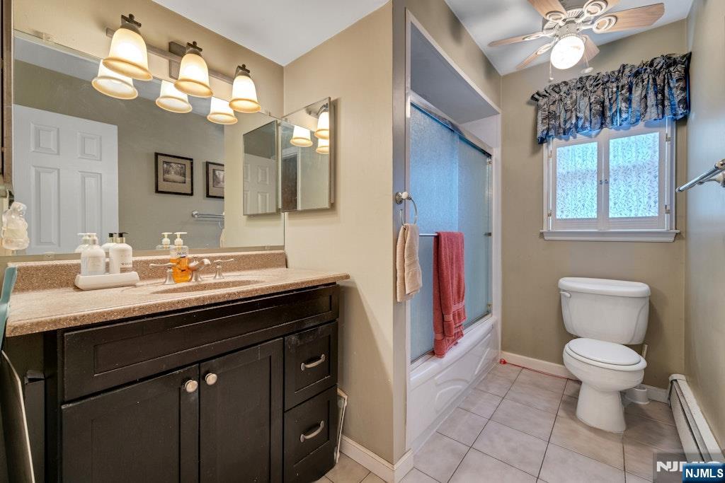 185 Ratzer Road Wayne, NJ 07470 - Photo 23 of 36 a bathroom with a sink a toilet and a mirror