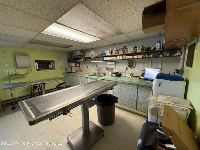 a room with furniture a rug and a wooden floor