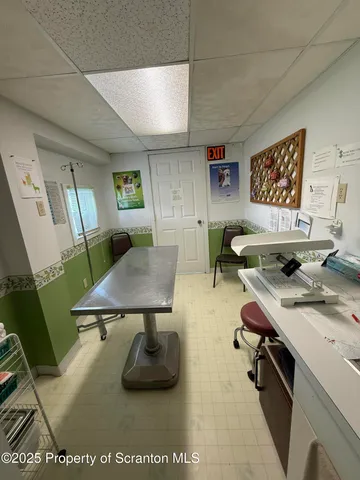 a workspace with furniture and window