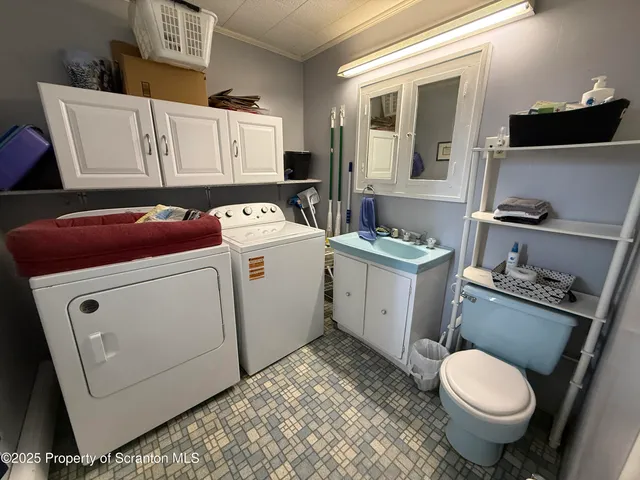 a bathroom with a sink toilet and mirror