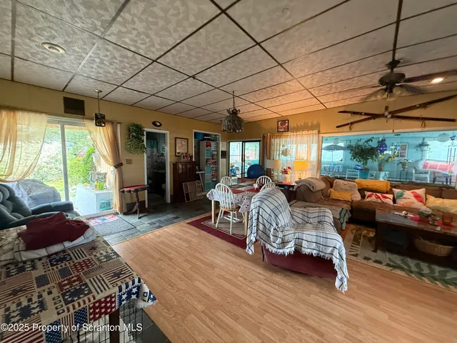 a bedroom with furniture a bed and a large window