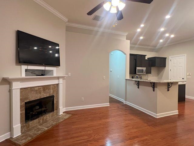 1977 Rochelle Lane Cordova, TN 38016 - Photo 2 of 26 a living room with stainless steel appliances furniture a fireplace a flat screen tv and a chandelier