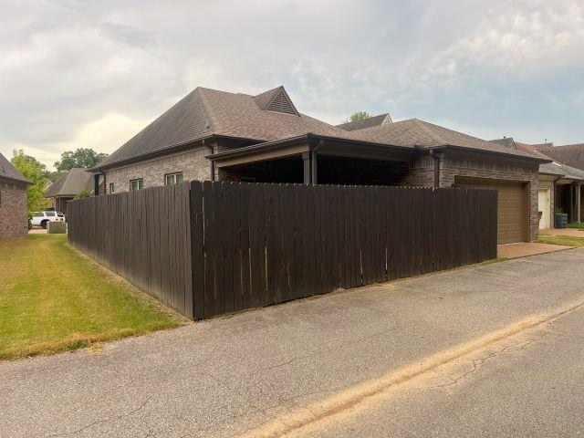 1977 Rochelle Lane Cordova, TN 38016 - Photo 20 of 26 a view of a house with a wooden fence