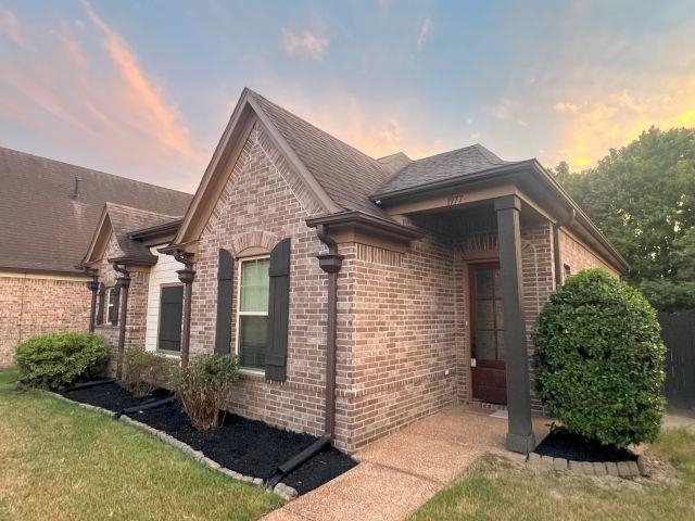 1977 Rochelle Lane Cordova, TN 38016 - Photo 21 of 26 front view of a house with a yard
