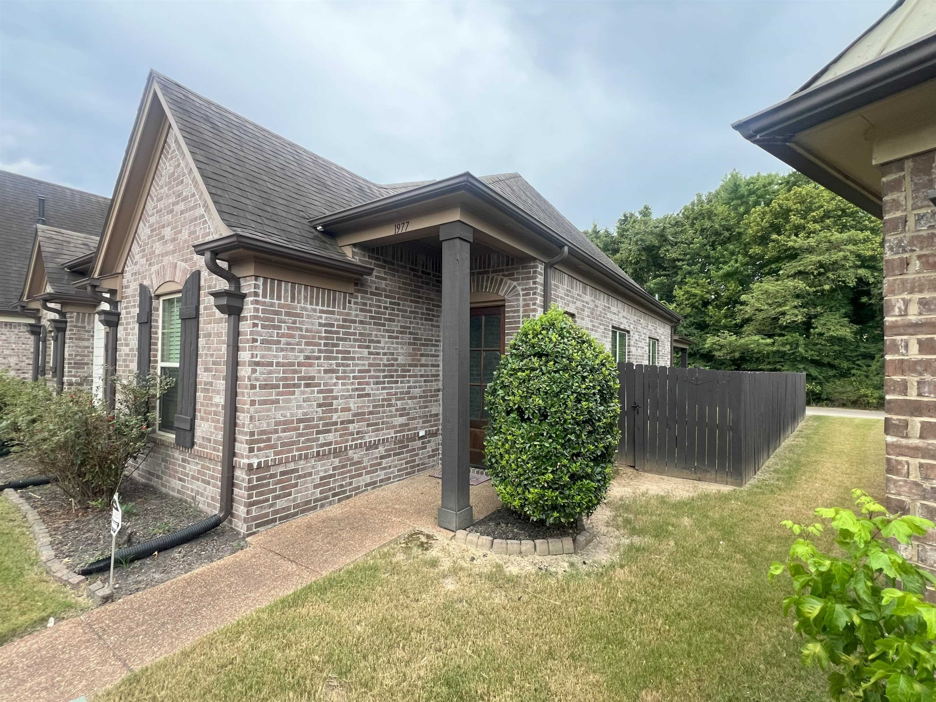 1977 Rochelle Lane Cordova, TN 38016 - Photo 23 of 26 a front view of a house with garden