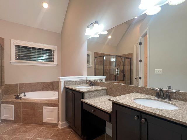 1977 Rochelle Lane Cordova, TN 38016 - Photo 7 of 26 a bathroom with a granite countertop sink a toilet a mirror and bathtub