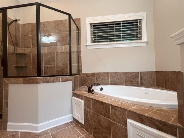 1977 Rochelle Lane Cordova, TN 38016 - Photo 9 of 26 a bathroom with a tub and a shower