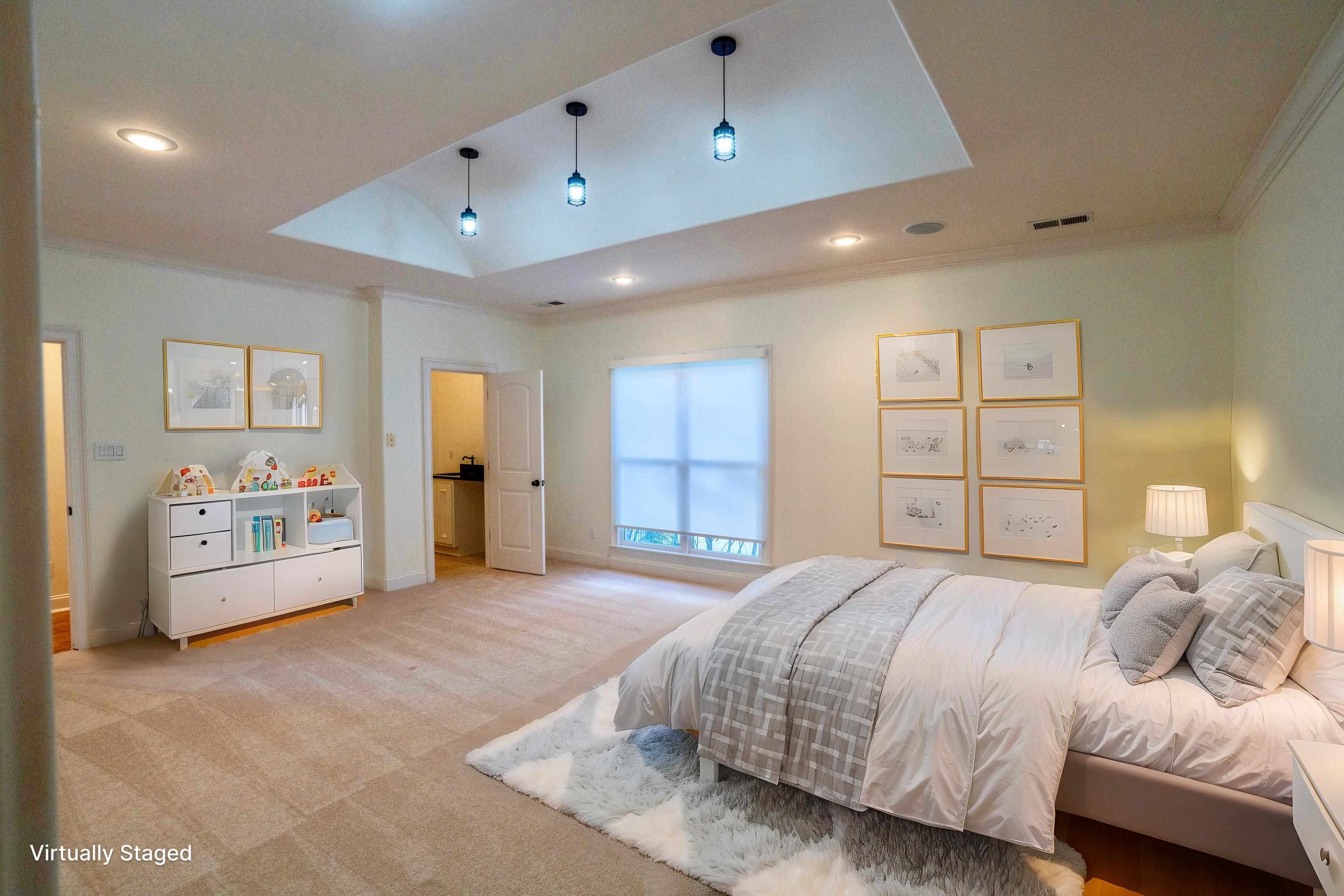 205 Jamerson Farm Road Collierville, TN 38017 - Photo 21 of 33 Bedroom featuring a skylight, baseboards, ornamental molding, recessed lighting, and light colored carpet