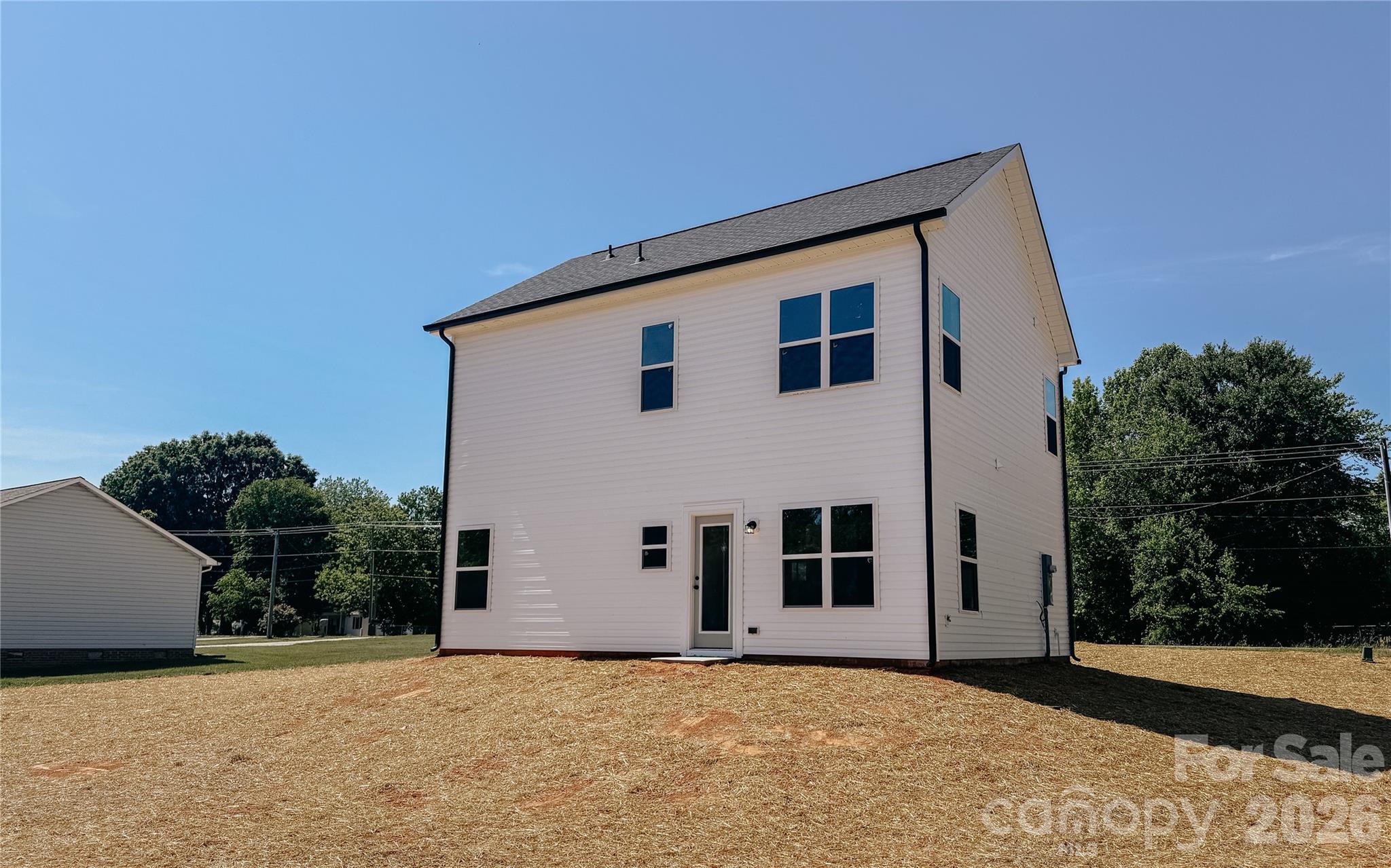1455 West Ridge Road Salisbury, NC 28147 - Photo 23 of 26 a big house with large windows and trees