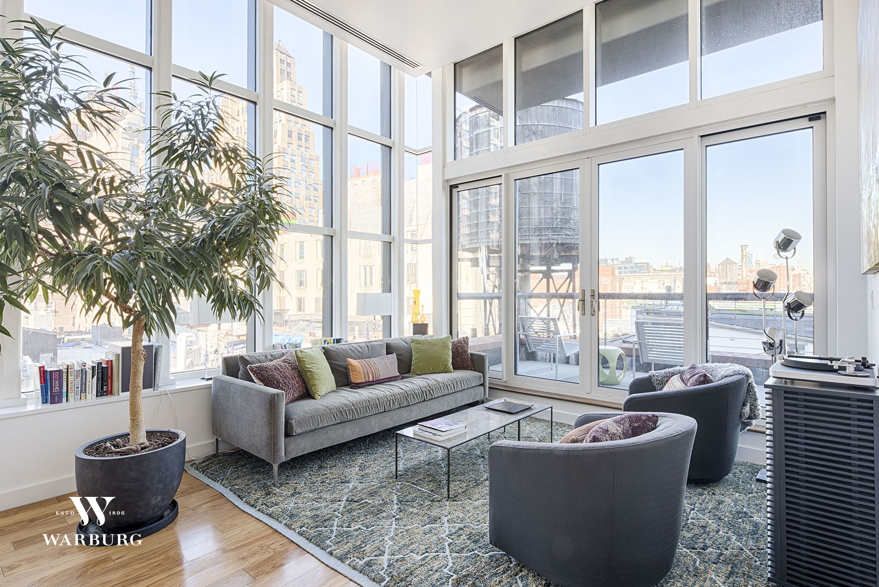 a living room with furniture and a large window