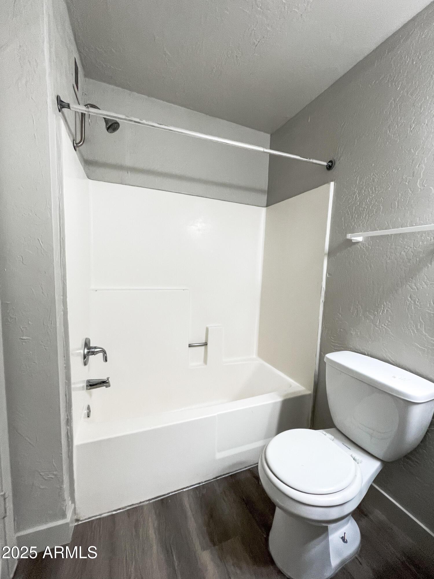 1421 East Fillmore Street, Unit 4 Phoenix, AZ 85006 - Photo 14 of 18 a bathroom with a toilet and a shower