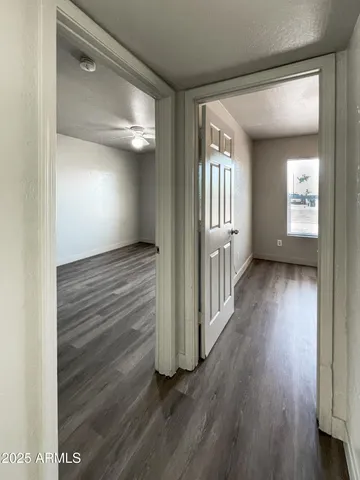wooden floor in a hall with an entryway
